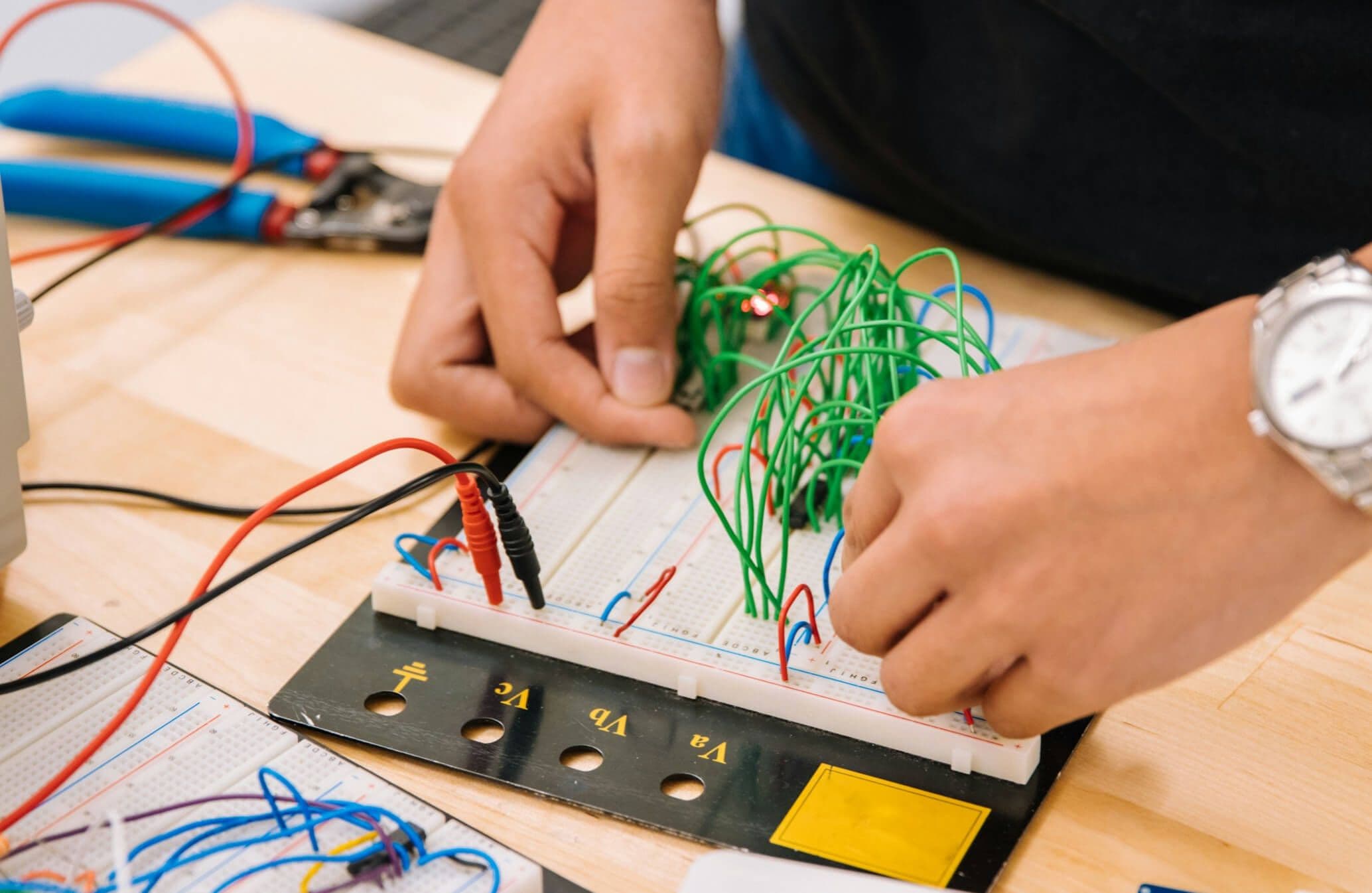 Person putting together a circuit board